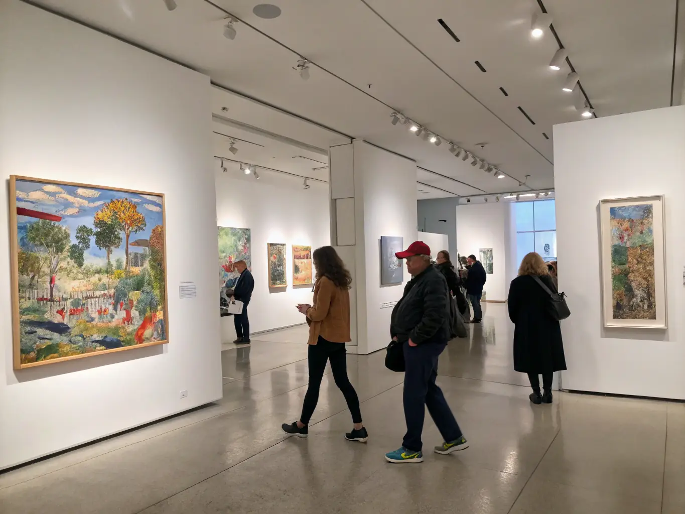 A visually appealing image of an art exhibition, showcasing a variety of artworks displayed in a gallery setting, with visitors admiring the pieces.